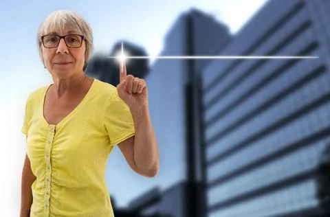 Empty touchscreen is shown by senior Stock Photos