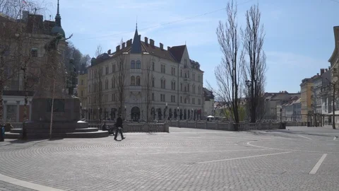  Empty town square with few people walking around. Stock Footage 126571514