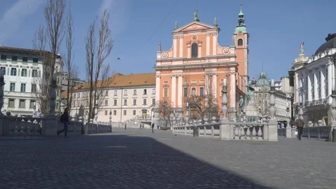 Empty town square with few people walking around. Stock Footage 126584574