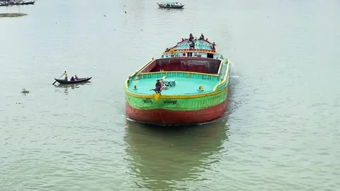 An Empty Traditional Cargo Ship Crossing The River In Dhaka, Bangladesh. Aerial Stock Footage 322569583