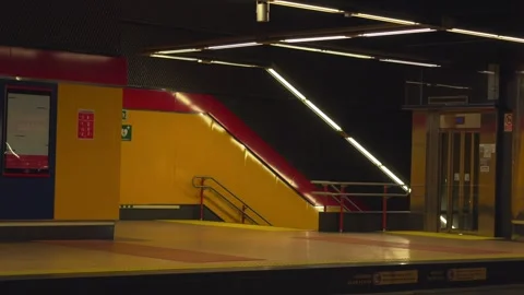 Empty train arriving at modern subway station platform Video stock 329592864