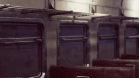 Empty train carriage shows metal interior and dark seats at midday Stock Footage 340619643