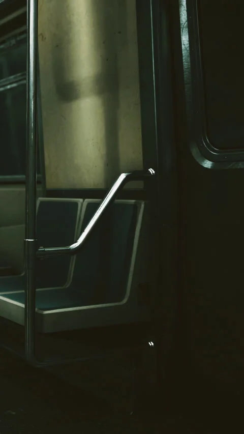Empty train doorway shows seats and a quiet interior in the city Stock Footage 334727114