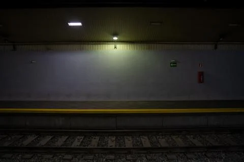 Empty train platform. Dark front view. Underground subway station Stock Photos