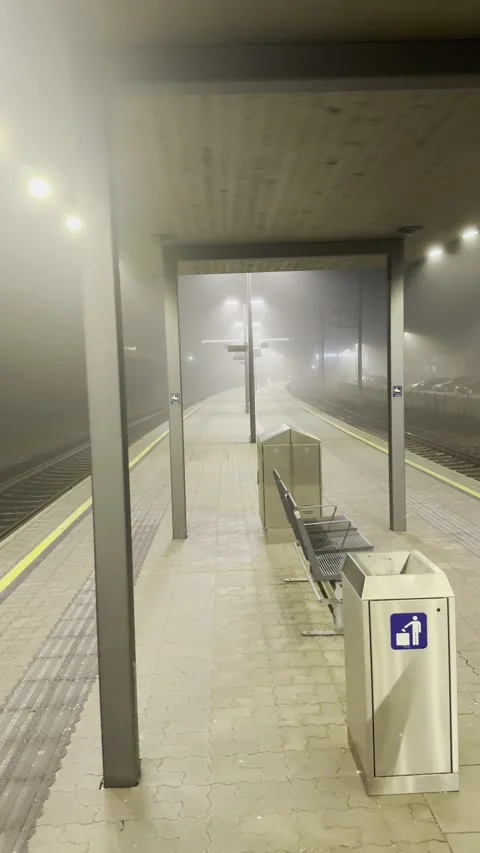 Empty train platform on foggy night in Austria Stock Footage 326938318