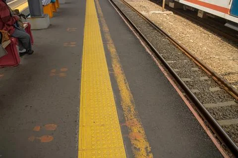 Empty train platform with yellow safety line Stock Photos