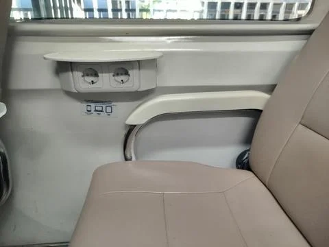 An empty train seat chair with few passengers. Фото