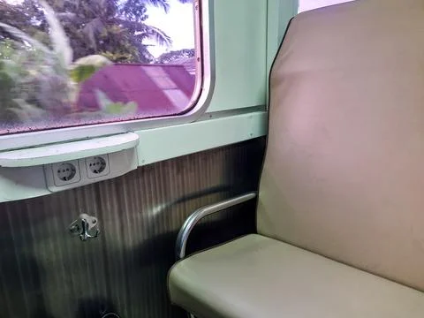 Empty Train Seat with Power Outlet and Cup Holder Fotos de archivo