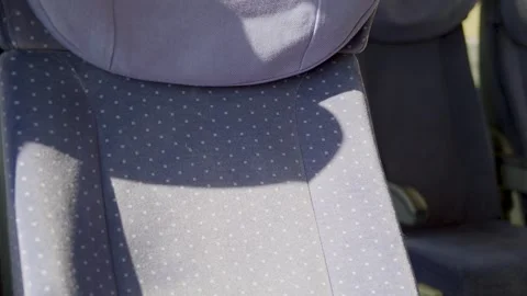 Empty train seat with sunlight and fabric texture inside a moving train Video stock 305472185