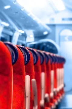 Empty Train Seats in a row - Light blue background Stock Photos