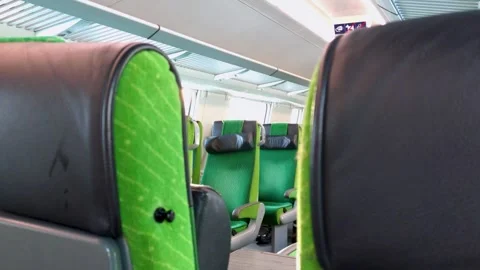 Empty train seats seen from a passenger seat on a winter journey from Kajaani Stock Footage 338187112
