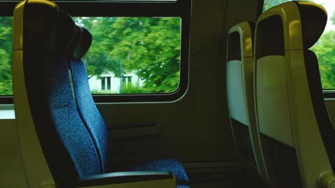Empty train sits in moving train Stock Footage 138454281