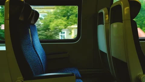 Empty train sits in moving train Stock Footage 138454522