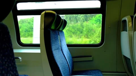 Empty train sits in moving train Stock Footage 138454690