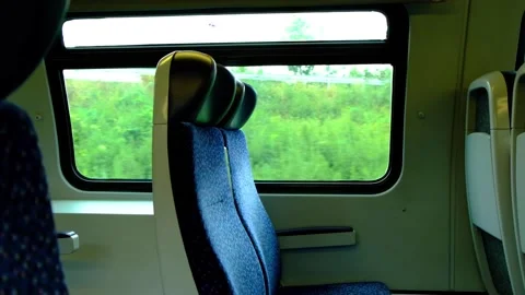 Empty train sits in moving train Stock Footage 138454781