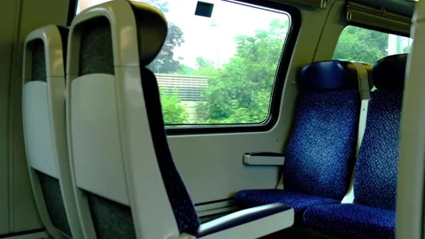 Empty train sits in moving train Stock Footage 138454807