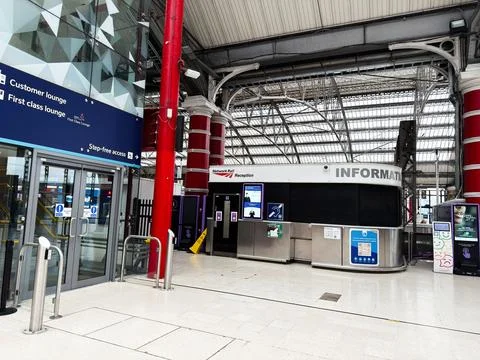 Empty train station concourse with information desk and customer lounges at.. Stock Photos