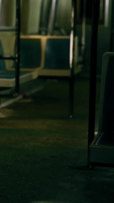Empty train station at night with dim lighting and few seats visible Stock Footage 342451168