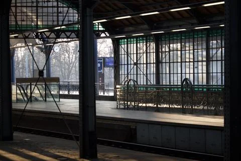 Empty train station platform in sunlight Stock Photos