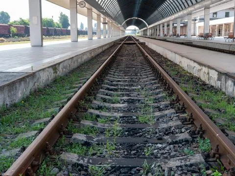 Empty train station. A platform under a glass roof. Stock Photos