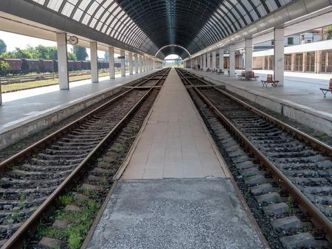 Empty train station. A platform under a glass roof. Stock-Fotos