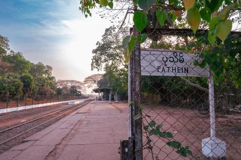 Empty train station with track and surrounding nature Stock Photos