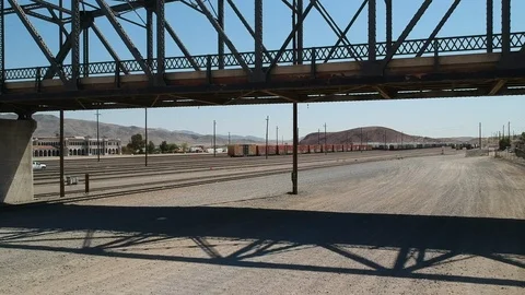 Empty train tracks - drone flying under bridge Video stock 107879694