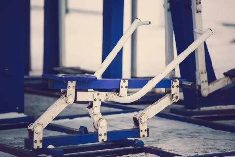 An empty training ground (workout) on the street in winter. Fitness equipment Stock Photos