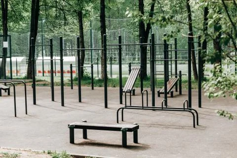 An empty training ground (workout) on the street, horizontal bars and benches Stock Photos