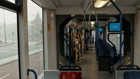 Empty tram journey through Amsterdam on a rainy day Stock Footage 334786410