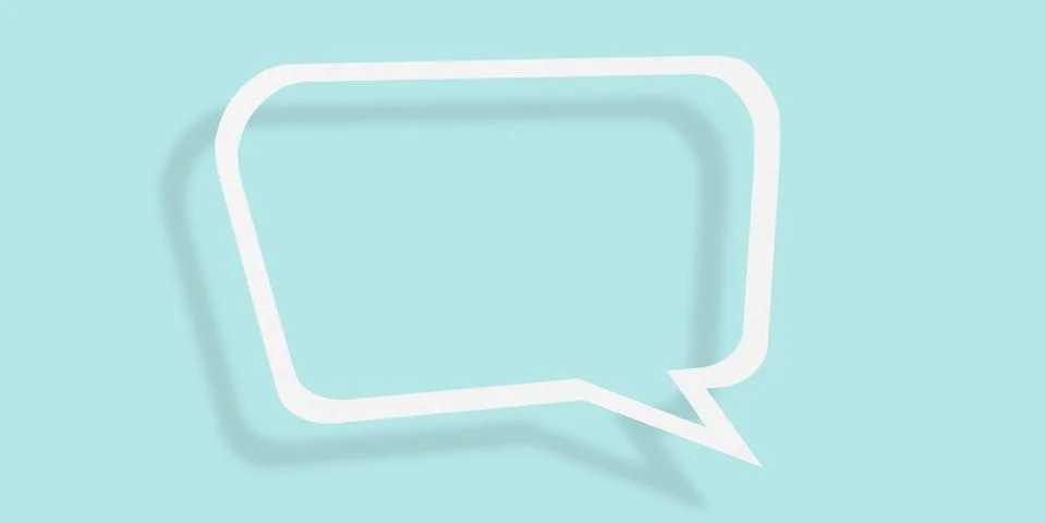 Empty transparent balloon paper speech bubble shape against light blue back.. Ilustración de archivo