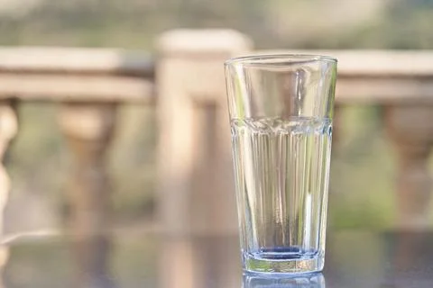Empty transparent glass cup on table Stock Photos