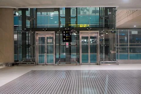 Empty transparent glass elevator facility inside Yogyakarta Stock Photos