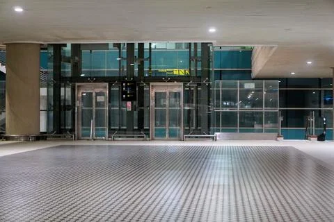 Empty transparent glass elevator facility inside Yogyakarta Stock Photos