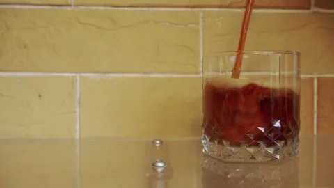 An empty transparent glass is filled with a soft drink. Copious foam forms. C Stock Footage 156130466
