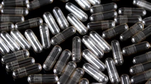 Empty Transparent Pills and Capsules on a Black Background. Stock Footage 197256332