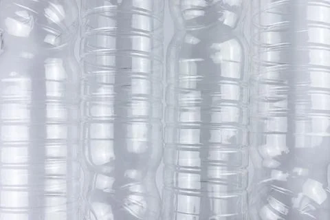 Empty transparent plastic bottle on white background. Top view. Pollution Stock Photos