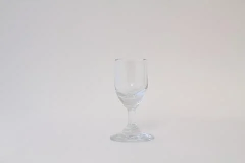 Empty transparent triangular glass for cosmopolitan cocktail Stock Photos