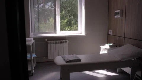 Empty treatment room with a comfortable bed Video stock 295137923