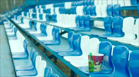 Empty tribune with a bottle and popcorn bucket only Stock Footage 63842791
