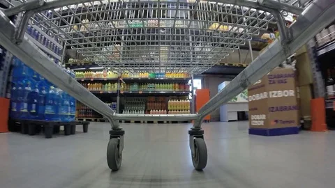 Empty trolley rushing through supermarket Stock Footage 82776348