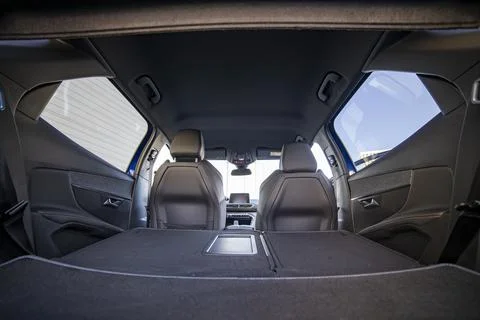 Empty trunk of a modern car with folded rear seats. large interior volume. tr Fotos Stock