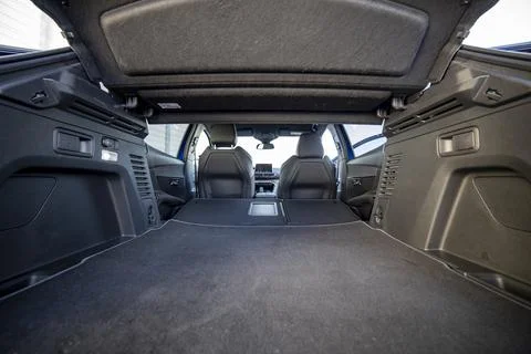 Empty trunk of a modern car with folded rear seats. large interior volume. trunk Stock Photos