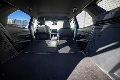 Empty trunk of a modern car with folded rear seats. large interior volume. trunk Stock Photos