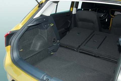 Empty trunk with rear seats folded of the small passenger car Stock Photos