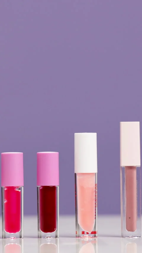 Empty, tube and lip gloss in studio for makeup, cosmetics or product review on Stock Footage 319016374