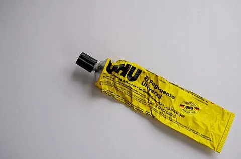 Empty tube of UHU multi-purpose adhesive. A German brand Stock Photos