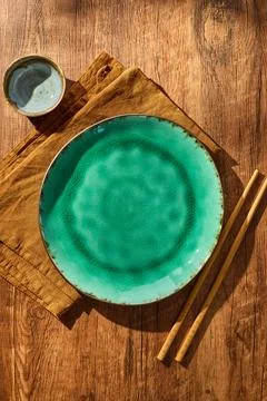 Empty Turquoise Ceramic Plate with Chopsticks and Soy Sauce on Wooden Table - Stock Photos
