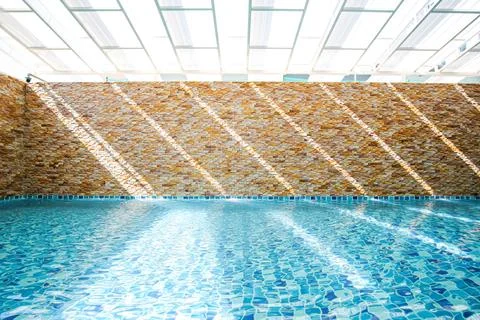 In an empty turquoise swimming pool. Stock Photos