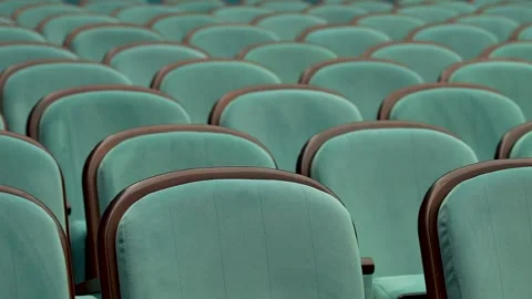 Empty turquoise theater chair awaiting audience Stock Footage 340896589